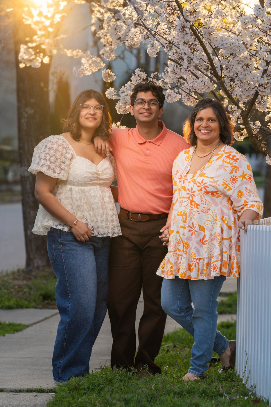 Aurita with her family under blossoming cherry trees